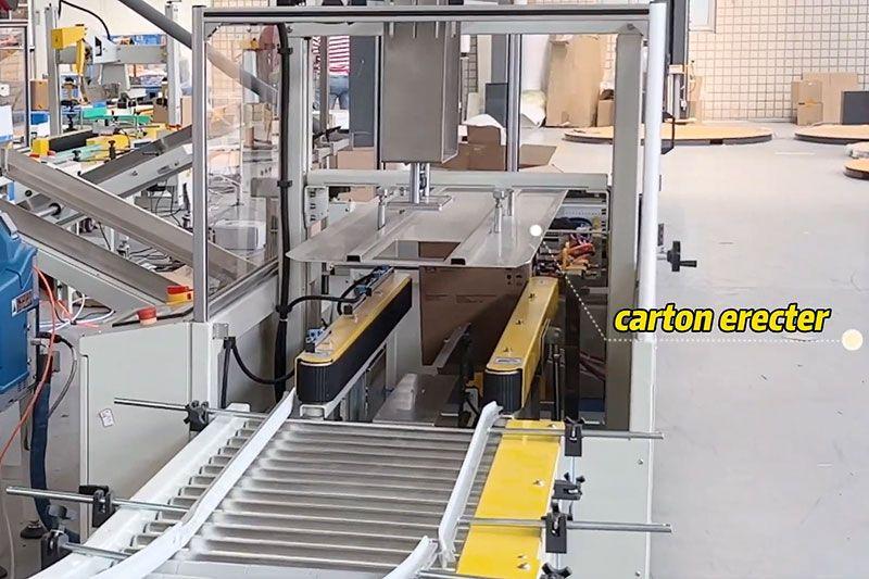 Carton erector opening a flat corrugated case before bottom sealing.