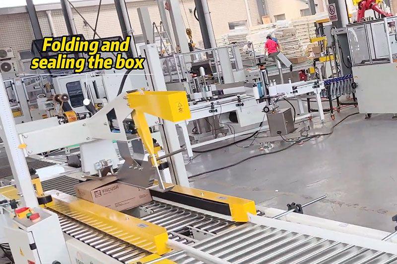 Case moving through the folding and sealing section of a Landpack line.