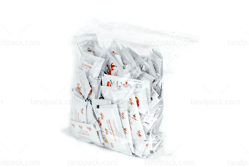 Packing Small Sauce Sachets Into Large Bag
