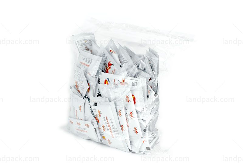 Packing Small Sauce Sachets Into Large Bag